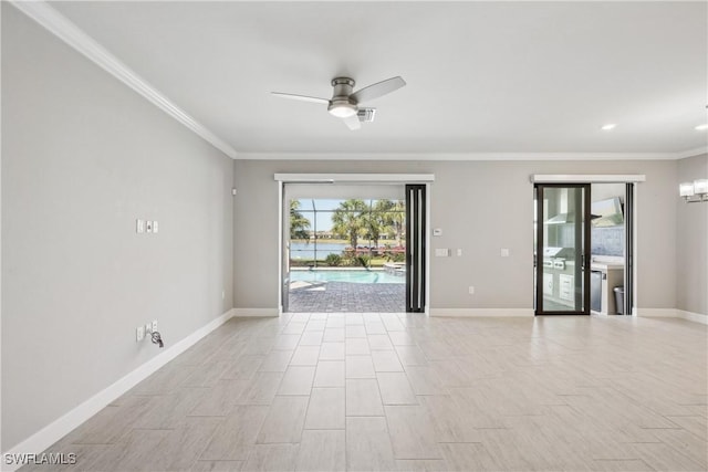 spare room featuring ceiling fan and crown molding