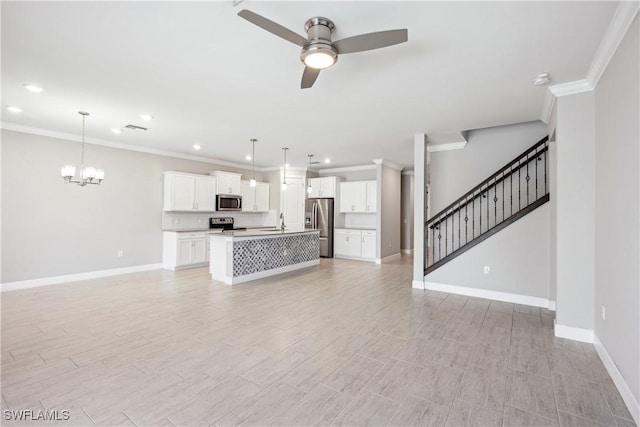 unfurnished living room with crown molding, ceiling fan with notable chandelier, and sink