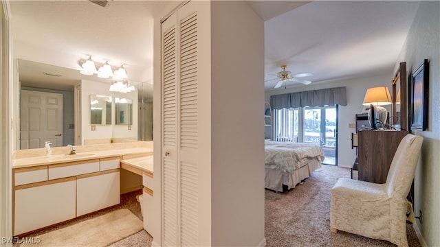 bathroom featuring vanity and ceiling fan