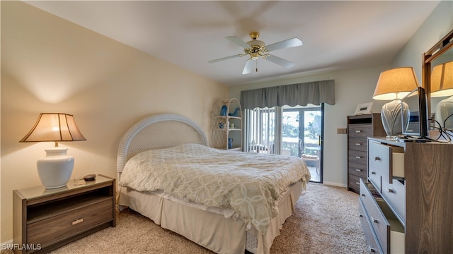 bedroom featuring light colored carpet, access to outside, and ceiling fan