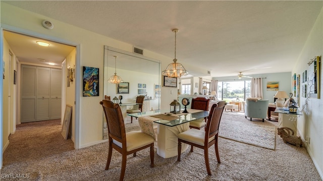 dining room featuring carpet flooring and ceiling fan