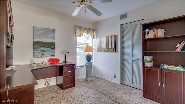 office space featuring light colored carpet and ceiling fan