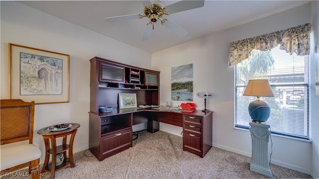 carpeted home office with ceiling fan