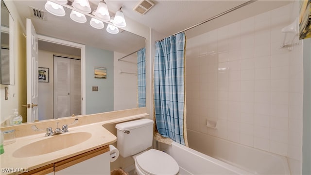 full bathroom with vanity, toilet, and shower / bath combo with shower curtain