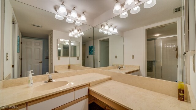 bathroom with vanity and an enclosed shower