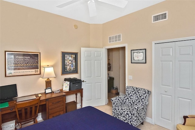 bedroom with a closet, ceiling fan, a high ceiling, and visible vents