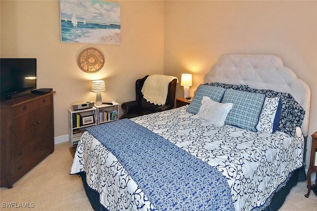 bedroom featuring light colored carpet