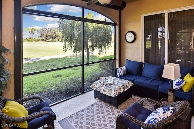 sunroom featuring an outdoor living space