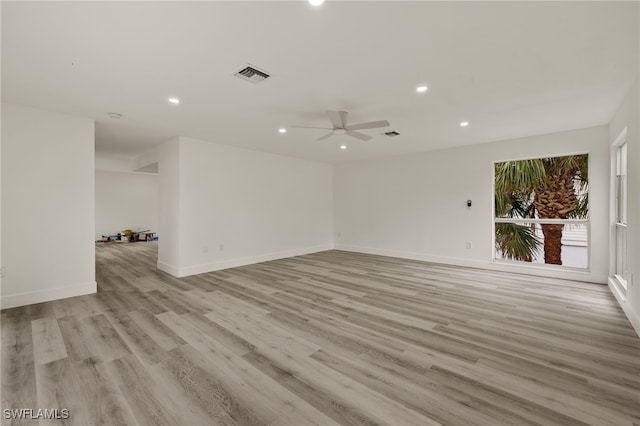 spare room featuring ceiling fan and light hardwood / wood-style floors