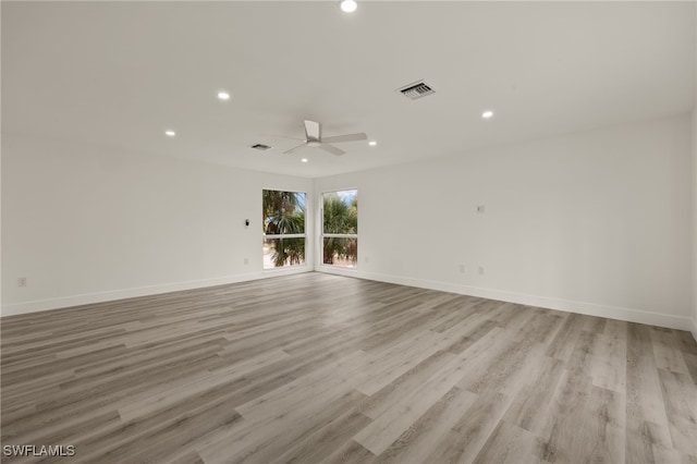 spare room featuring ceiling fan and light hardwood / wood-style floors