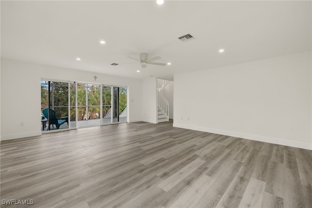 unfurnished room with ceiling fan and light hardwood / wood-style floors