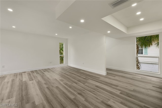 empty room with light hardwood / wood-style floors