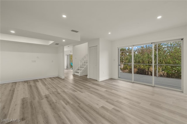 unfurnished living room featuring light hardwood / wood-style flooring