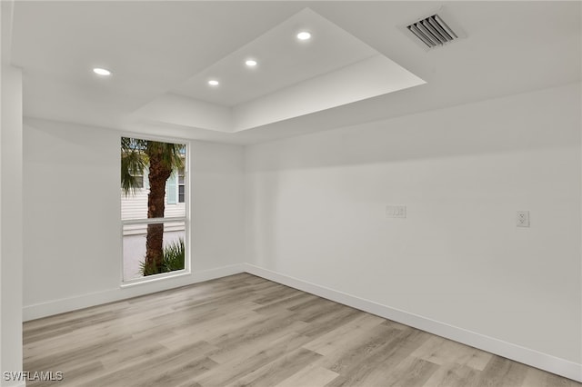 unfurnished room with light wood-type flooring