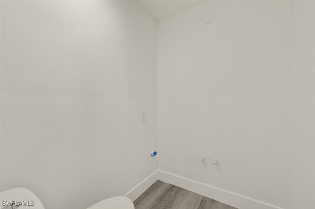 laundry room with light hardwood / wood-style flooring