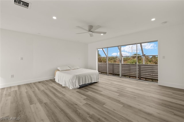 unfurnished bedroom featuring ceiling fan and light hardwood / wood-style floors