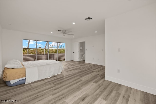 unfurnished bedroom featuring ceiling fan and light hardwood / wood-style floors