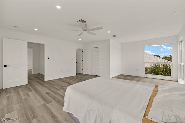 bedroom featuring ceiling fan and light hardwood / wood-style flooring