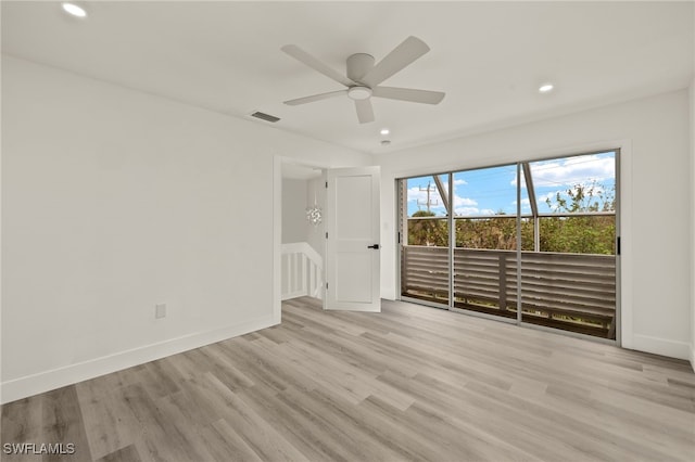 empty room with ceiling fan and light wood-type flooring