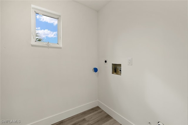 washroom featuring hookup for a washing machine, hardwood / wood-style flooring, and electric dryer hookup