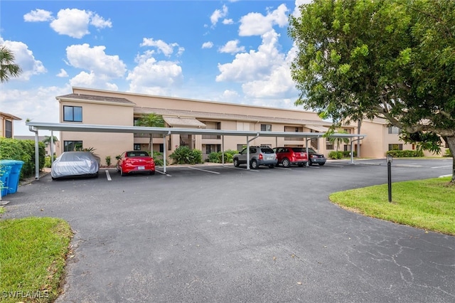 view of parking / parking lot with a carport