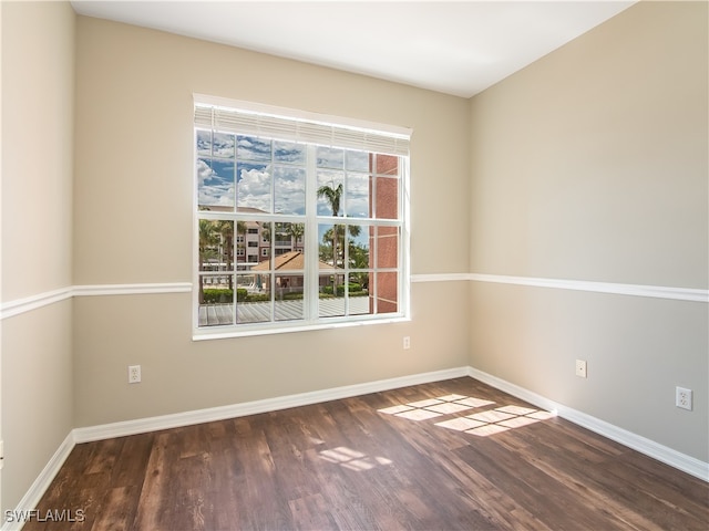 empty room featuring dark hardwood / wood-style floors