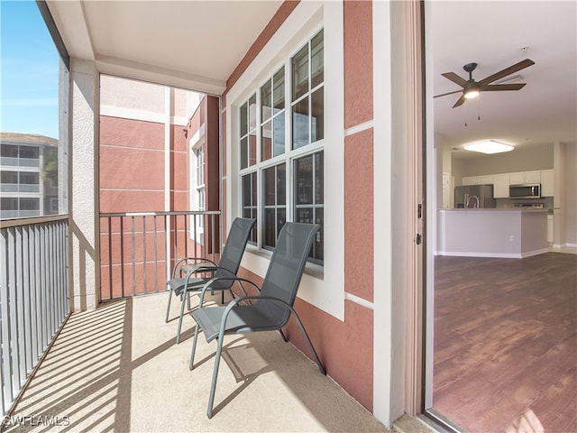 balcony featuring ceiling fan