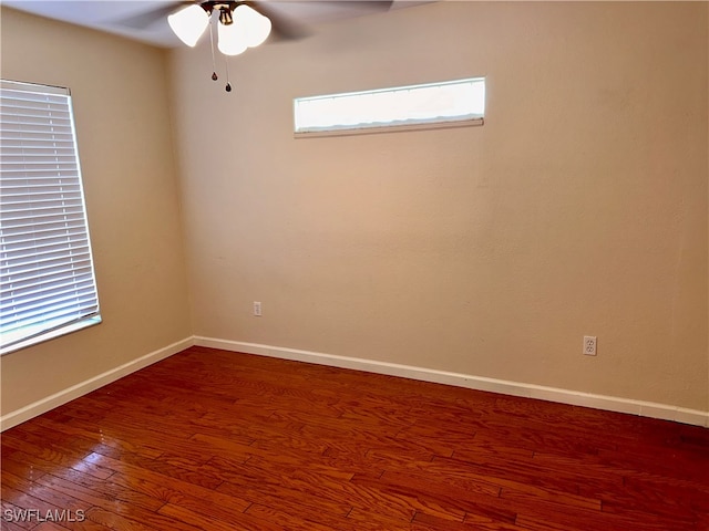 empty room featuring hardwood / wood-style floors and ceiling fan