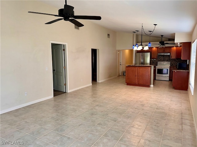 kitchen with backsplash, pendant lighting, appliances with stainless steel finishes, and a center island