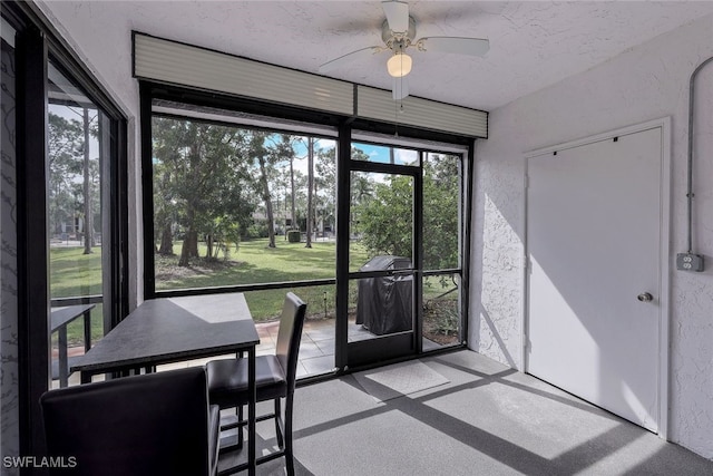 sunroom / solarium with ceiling fan