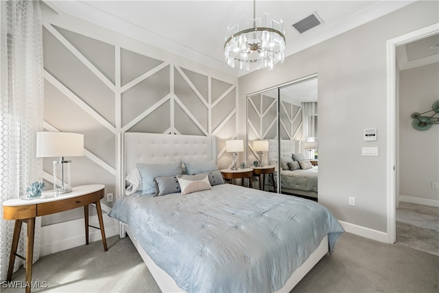 bedroom featuring an inviting chandelier, carpet flooring, and a closet