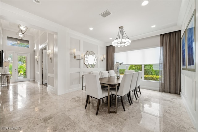 dining room featuring ornamental molding