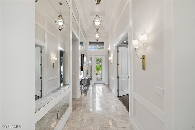 foyer entrance with a towering ceiling