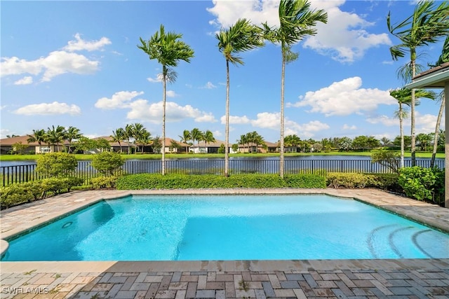 view of swimming pool featuring a fenced backyard, a fenced in pool, and a water view