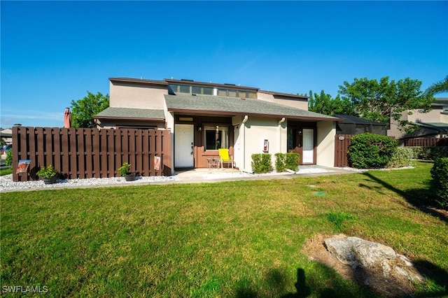 exterior space with a patio and a front yard