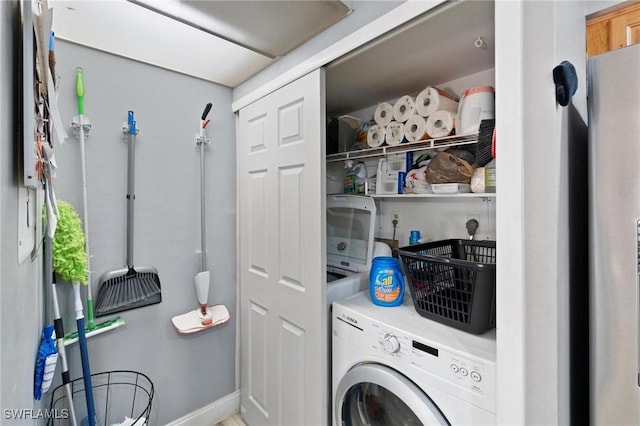 8913 Somerset Blvd, Fort Myers, FL 33919 - washroom featuring baseboards, laundry area, and washer / clothes dryer