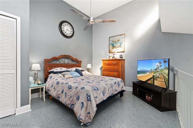 bedroom with ceiling fan and a high ceiling