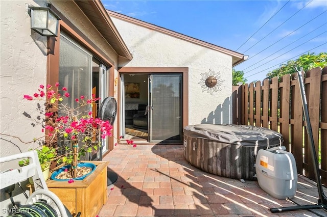 8913 Somerset Blvd, Fort Myers, FL 33919 - view of patio / terrace with a hot tub and fence