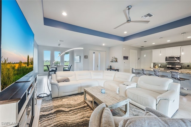 living room with ceiling fan