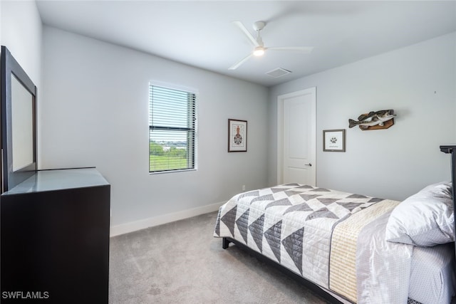 bedroom featuring light carpet and ceiling fan