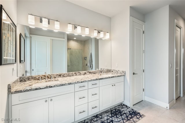 bathroom with vanity, tile patterned flooring, and an enclosed shower