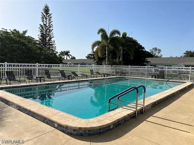 view of swimming pool featuring a patio area