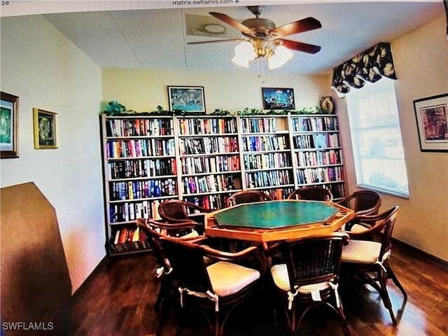 rec room featuring ceiling fan and dark wood-type flooring