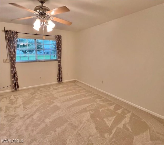 carpeted empty room with ceiling fan