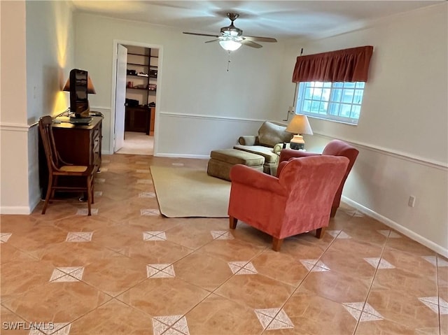 living area with light tile patterned floors and ceiling fan