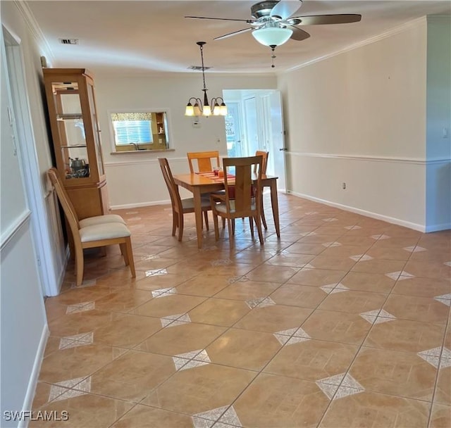 tiled dining room featuring ceiling fan with notable chandelier and ornamental molding