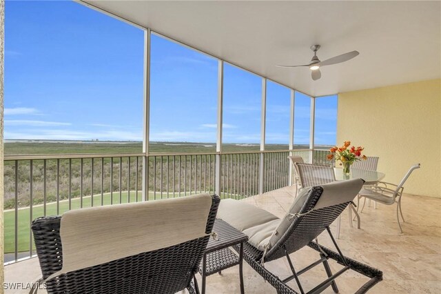 4751 W Bay Blvd Unit 1005, Estero, FL 33928 - sunroom with ceiling fan, outdoor dining space, and plenty of natural light