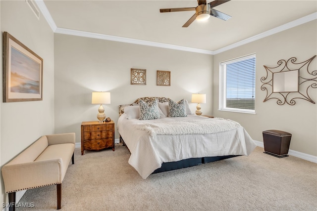 carpeted bedroom featuring ceiling fan and ornamental molding