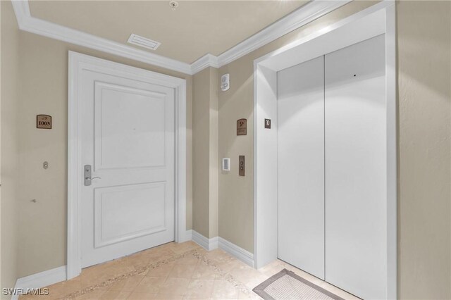 4751 W Bay Blvd Unit 1005, Estero, FL 33928 - hallway with elevator, crown molding, baseboards, and light tile patterned floors