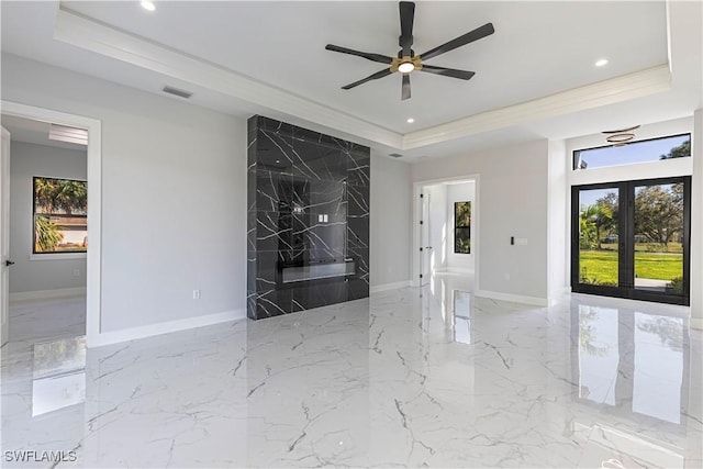 empty room featuring recessed lighting, visible vents, marble finish floor, french doors, and a tray ceiling